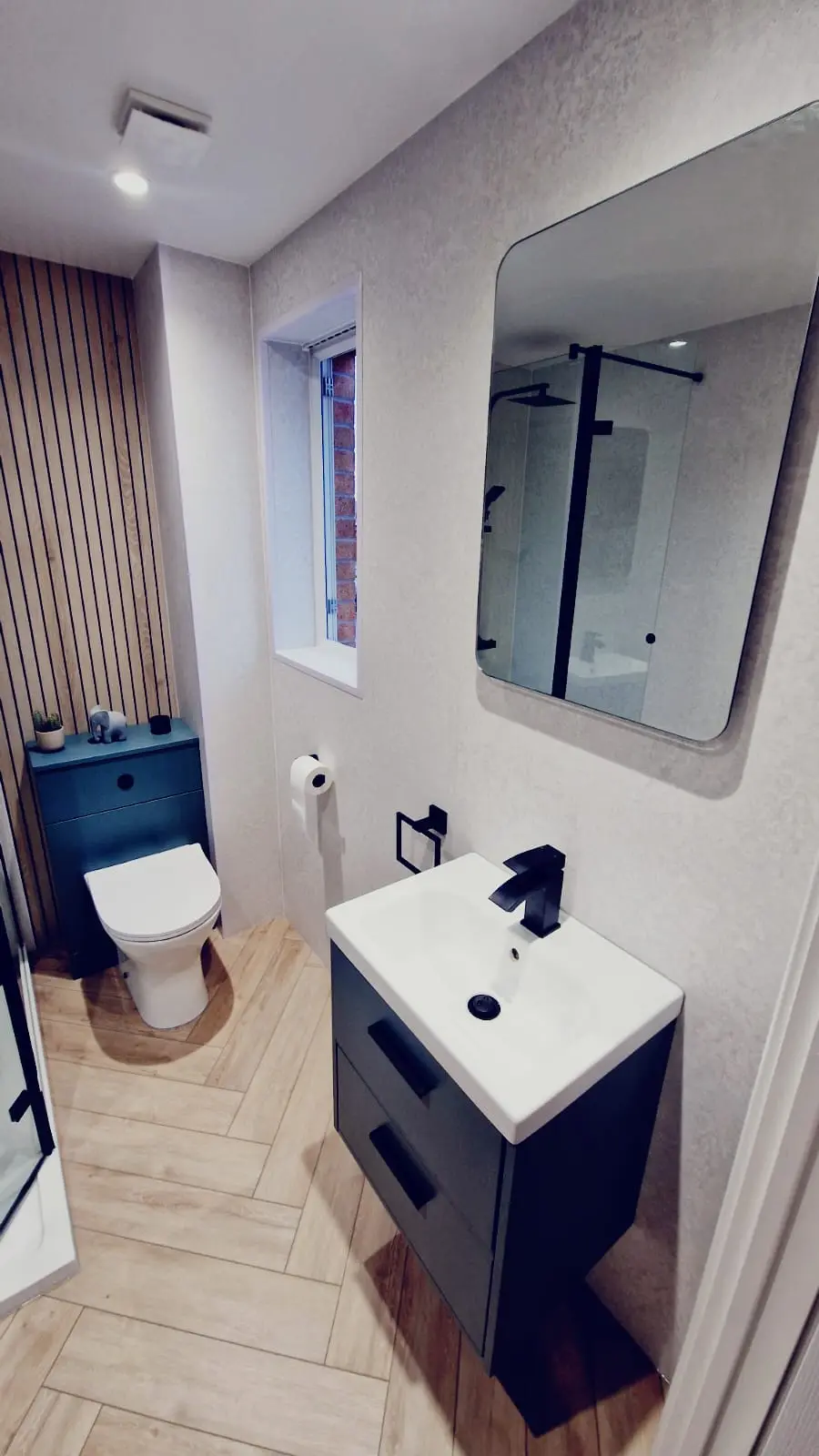 Tiled bathroom with mosaic floor detail